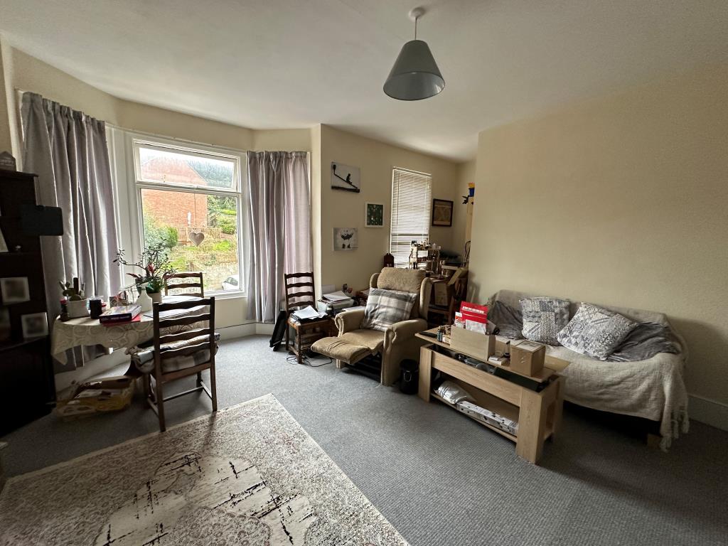 Lot: 140 - TWO-BEDROOM FLAT FOR INVESTMENT - Living room with bay window overlooking Nelson Road